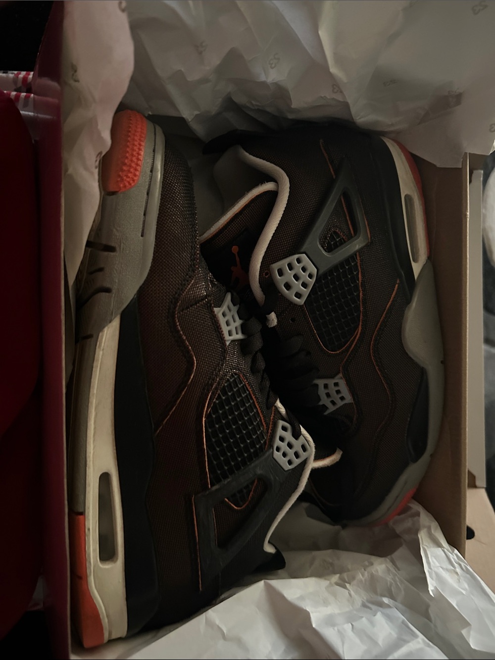 Jordan Black with Orange Trim Retro 4 Sneakers
